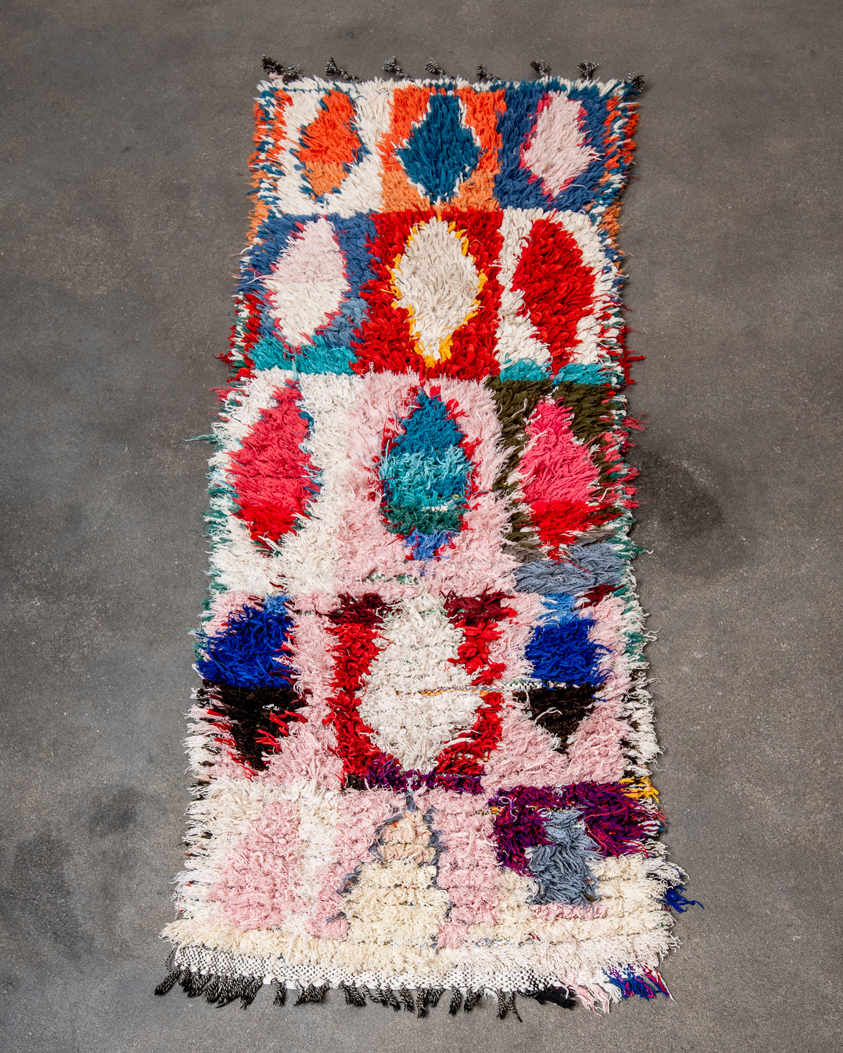 Modern designer vintage handcrafted Berber rug from Morocco. Boucherouite runner rug with beautiful colors and patterns.